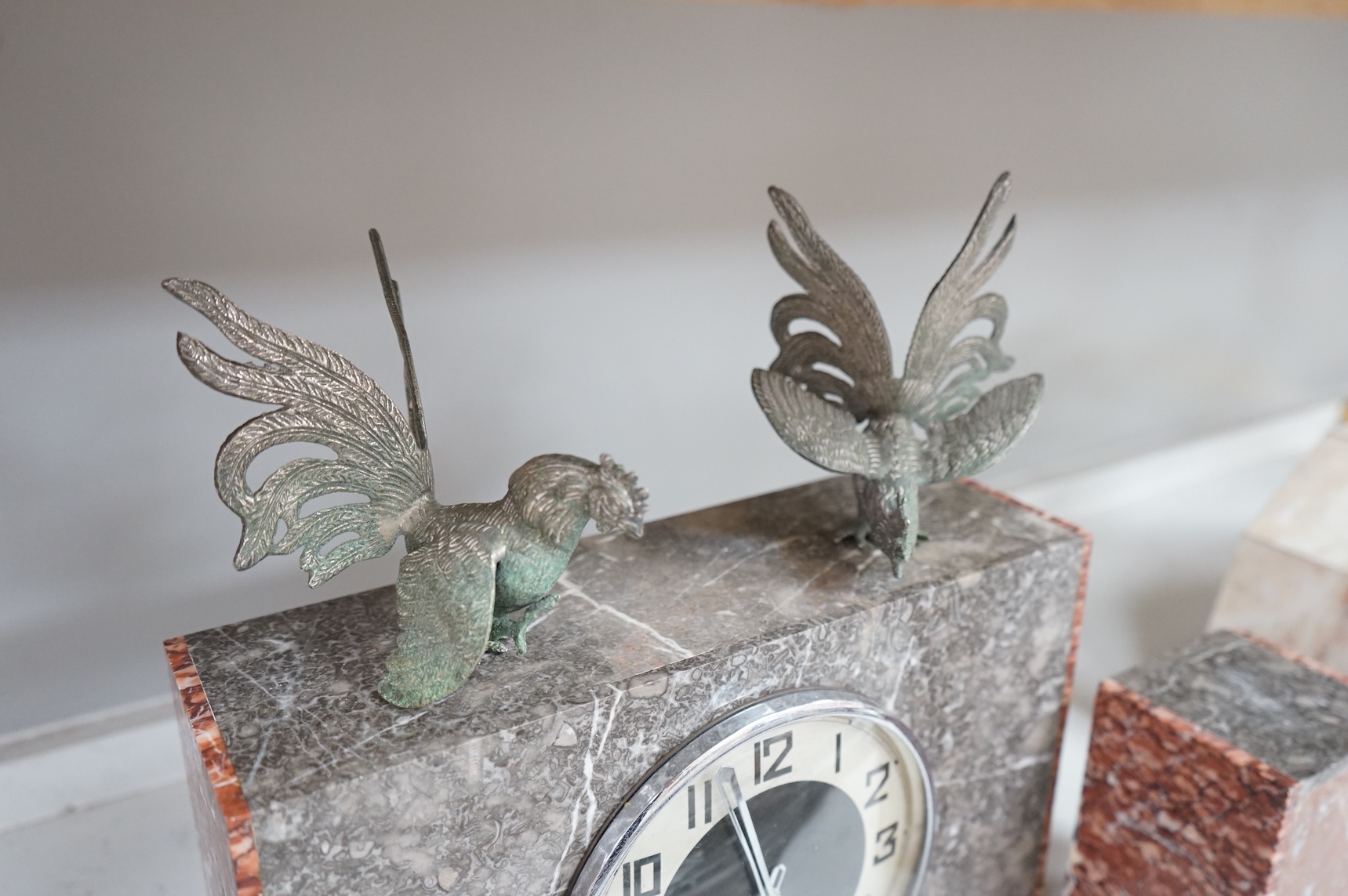 An Art Deco marble clock garniture and a French clock surmounted with two deer, with key, 44cm wide